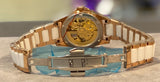 Faioki ladies mechaical watch with butterfly features on the pinkish nacre dial