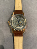 Ladies dress watch with beautiful and striking bronze skeleton dial and diamantes bezel